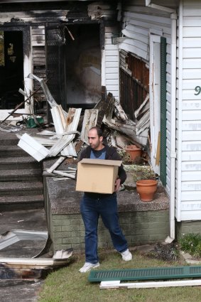 Alex Haddad outside his investment property in Sydney's Ryde that was destroyed by fire.