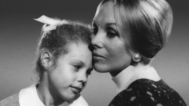 Anne Hamilton-Byrne with a young member of The Family.