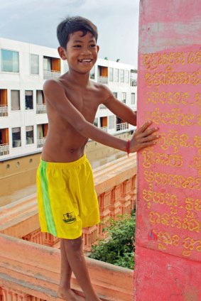 Welcoming grin: A child meets the ship La Marguerite at Angkor Ban.