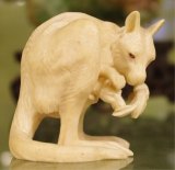 A carved ivory ornament with an Australian theme.