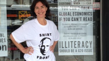 Avid Reader Bookshop owner Fiona Stager wearing the Shirt Front Putin t-shirt.
