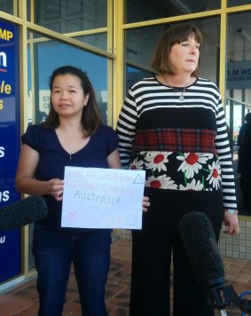 Maria Sevilla and Queensland Nurses Union secretary Beth Molle deliver the petition to Health Minister Peter Dutton's office.