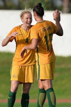 Clare Polkinghorne (L) and Emily Gielnik of Australia celebrate the victory at the end of the Women's Algarve Cup Tournament match between China and Australia.