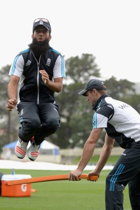 England high: Moeen Ali and Chris Woakes warm up ahead of a nets session at Bellerive Oval. 