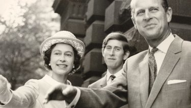 Been coming here long? The Queen, Prince Charles and Prince Phillip stop to wave outside the Town Hall during a visit to Melbourne in 1970.
