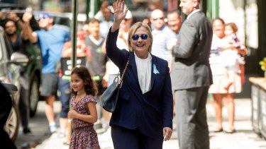 Hillary Clinton waves after leaving her daughter's apartment after her health turn on September 11. Some conspiracy theorists claimed that this is a body double and not Mrs Clinton.