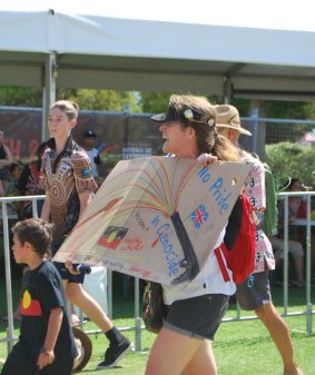 Protesters marching through the City Of Perth's Survival Day concert. 