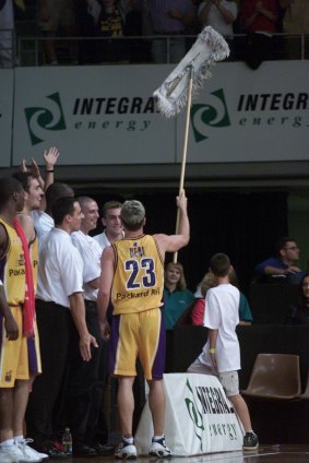 Clean sweep: Shane Heal celebrates with Sydney fans as the Kings complete a 3-0 season sweep over the West Sydney Razorbacks in 2001.