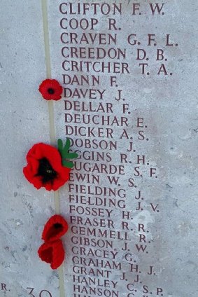 One of Joan Christie's hand-crafted poppies from Hall is placed beside the name of Stephen Eugarde at the Lone Pine memorial in Gallipoli.