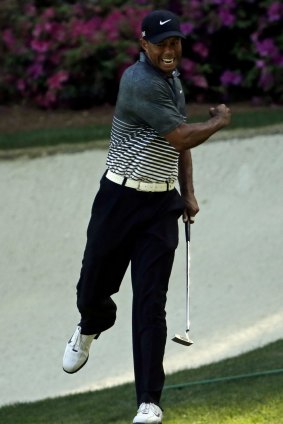 Tiger Woods reacts after his eye-catching birdie on the 13th.