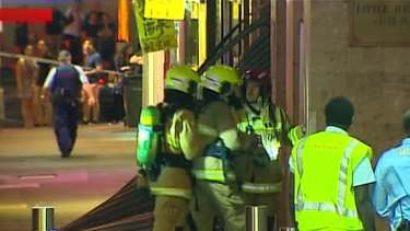 Firefighters enter the Dixon House shopping centre where a gas explosion struck on Tuesday night.