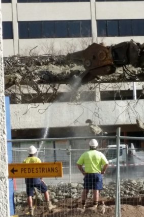 The demolition of a footbridge connecting Woden Plaza.