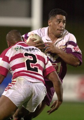 In his playing days: John Hopoate takes the ball up for Manly against St George Illawarra in 2001.