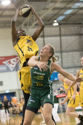 Sydney import Asia Taylor drags in a rebound over Sara Blicavs. 