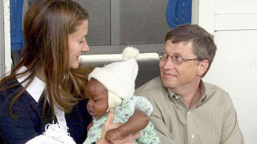 Melinda and Bill Gates with Cecilia Massango during a visit to a research centre in Mozambique in 2003. The couple has been funding malaria research since 2000.