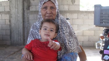 Dalal Siyam, 67, with baby Myar, 16 months.