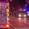 Firefighters outside a vape and tobacco store on Sydney Road, Coburg on June 7.