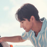 Just drive your car right onto the beach to watch some surfing videos from your boot.
