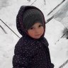 Fatema, the then two-year-old daughter of Mariam Dabboussy and granddaughter of Kamalle Dabboussy, in the snow at al-Hawl camp in 2020.