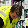 The Australian Border Force officers check illegal cigarette imports found in shipping containers in Melbourne.