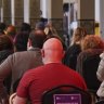 People receiving the AstraZeneca COVID-19 vaccine at the Melbourne Exhibition Centre vaccination hub in August 2021.