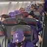 West Coast and Fremantle share a chartered flight on Tuesday, with some not wearing masks correctly.
