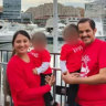 Anand Runwal and his wife Poonam with their twin daughters.