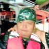 Rescuers carry a woman following the sudden rise in floodwaters as Typhoon Goni hit Batangas province, south of Manila.