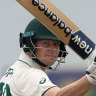 Steve Smith celebrates scoring his 10,000th Test run.