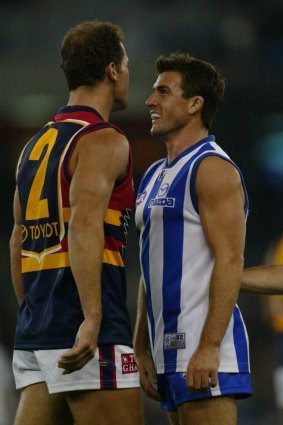 Anthony Stevens confronts Wayne Carey during round six of the 2003 season.