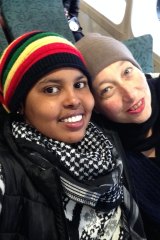 Hani Abdile with Janet Galbraith on the ferry to Manly in 2015, after Hani was moved to community detention in Sydney.