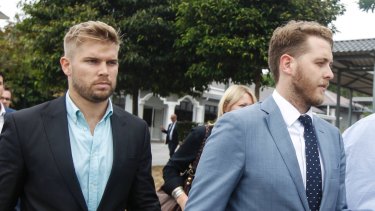 Edward Leaney and Jack Walker leave court in Sepang, Malaysia.