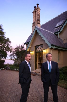 Prime Minister Tony Abbott and Opposition Leader Bill Shorten greet guests at Kirribilli House.
