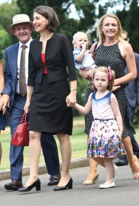 NSW Premier Gladys Berejiklian and her ministers and families walk towards Government House.