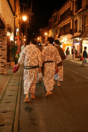 Strolling between onsens in Osaka.