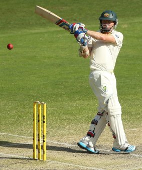 Timely runs: Australian opener Chris Rogers scores his second half-century of the match.