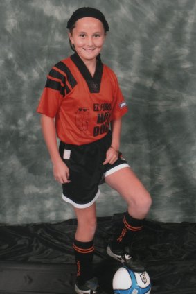 Rae Anderson, posing for a soccer team photo, says people should be themselves and "do what you want to do". 