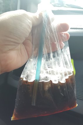 A soft drink served in a plastic bag.