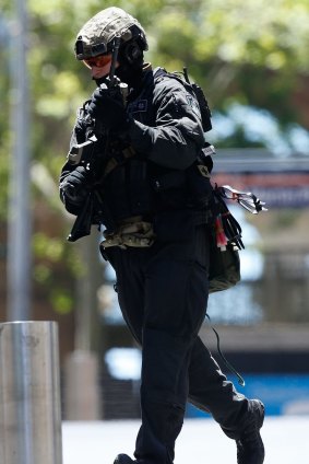 A police officer at the scene of the siege in Sydney.
