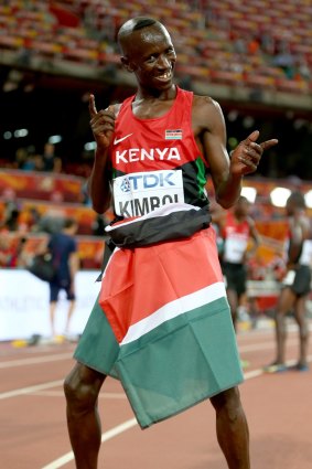 Kemboi celebrates after winning gold.