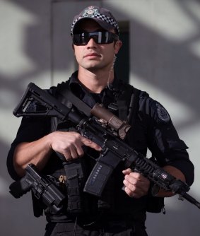 An AFP officer outside Parliament House.