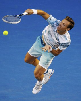 Tomas Berdych powers down a serve against Andy Murray.