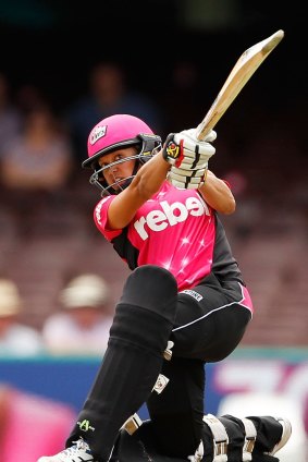 Feeling confident: Angela Reakes of the Sixers hits a six during the Women's Big Bash League match against the Sydney Thunder.