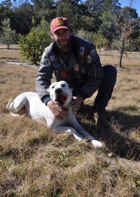 Truffle producer George with his trusty truffle dog Elsa, who is rewarded with ball time every time she finds one.