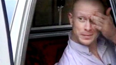 An image taken from video obtained from Voice Of Jihad Website showing Bergdahl in a vehicle guarded by Taliban.