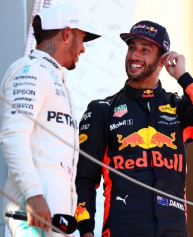 Ricciardo and winner Lewis Hamilton on the podium in Spain.