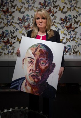 Christie Buckingham with Myuran Sukumaran's portrait of Andrew Chan.