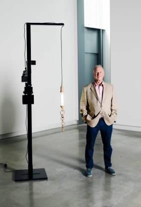 Michael Buxton, in the Buxton Contemporary museum, by Mikala Dwyer sculpture, Black lamp with Madonna and magnetic sculpture, 2011 (mixed media, 256cm X 50cm X 50cm).
