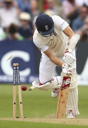 England's Mark Wood is yorked by Starc.