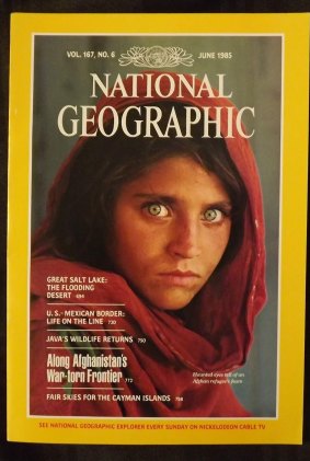 The National Geographic Magazine's most famous cover, with the iconic picture of an Afghan refugee girl by American photographer Steve McCurry.